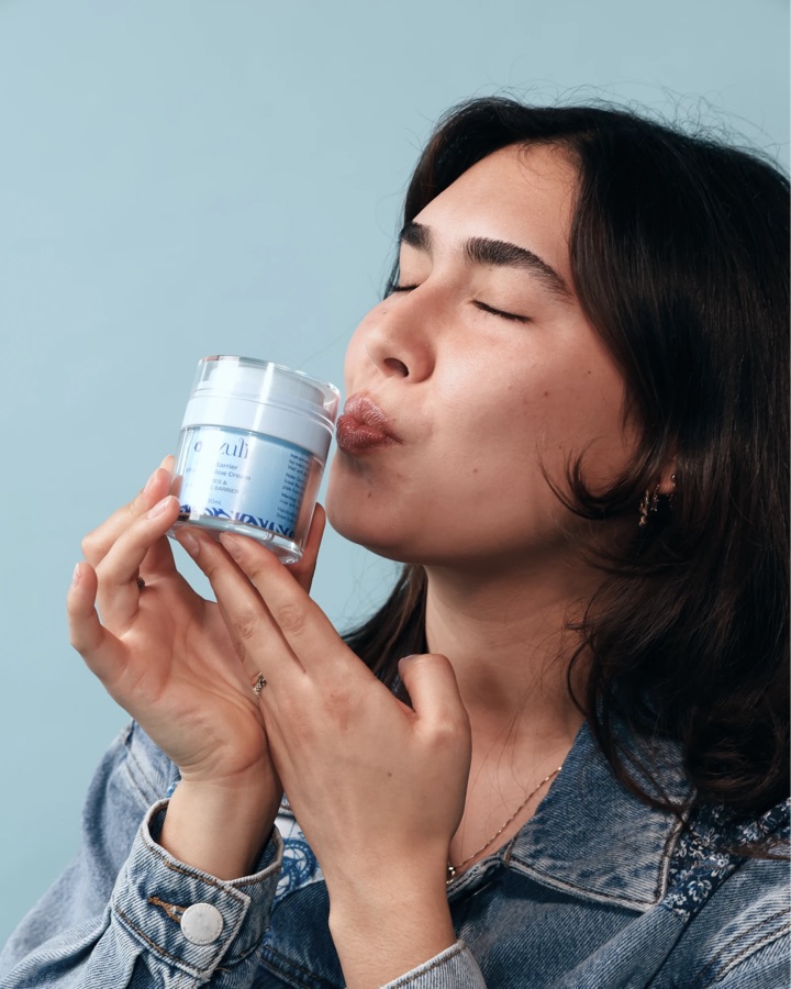 A model kissing a Blu Blu Barrier jar